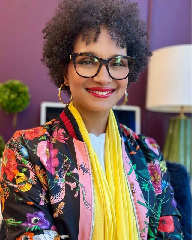Courtney McLeod in a floral jacket and yellow scarf